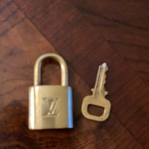 Louis Vuitton lock and key, authentic.